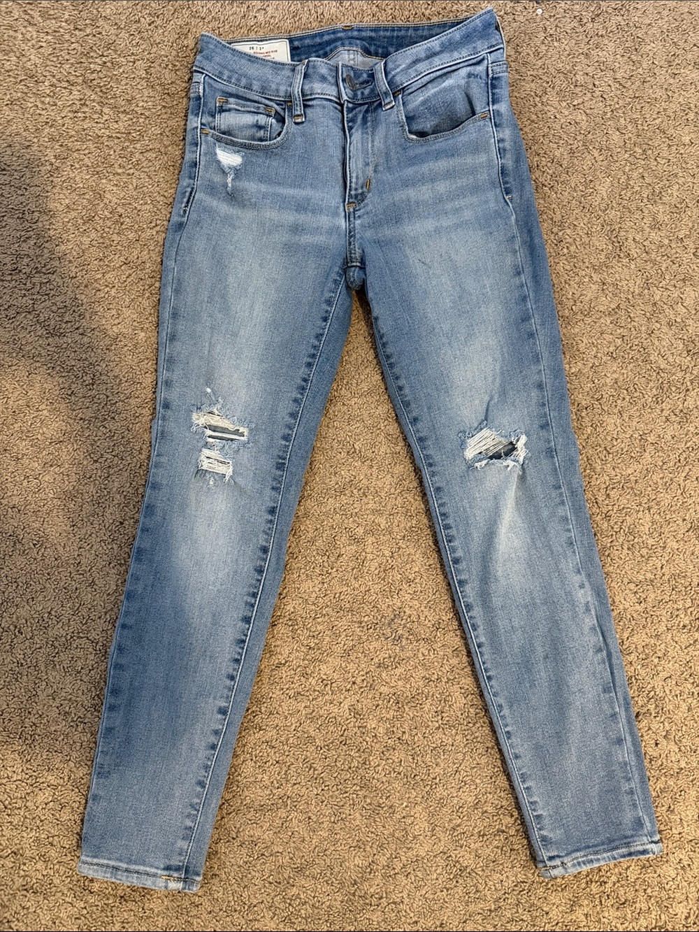 Women’s Light Blue Skinny Jeans with Distressed Knees
